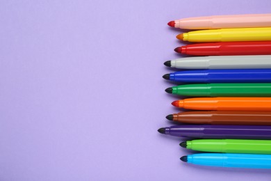 Photo of Different colorful markers on light background, flat lay. Space for text