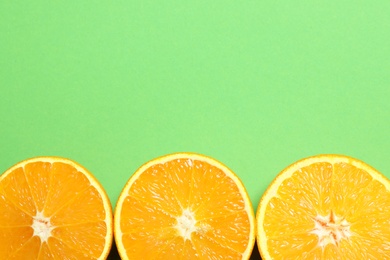 Photo of Flat lay composition with ripe oranges and space for text on color background