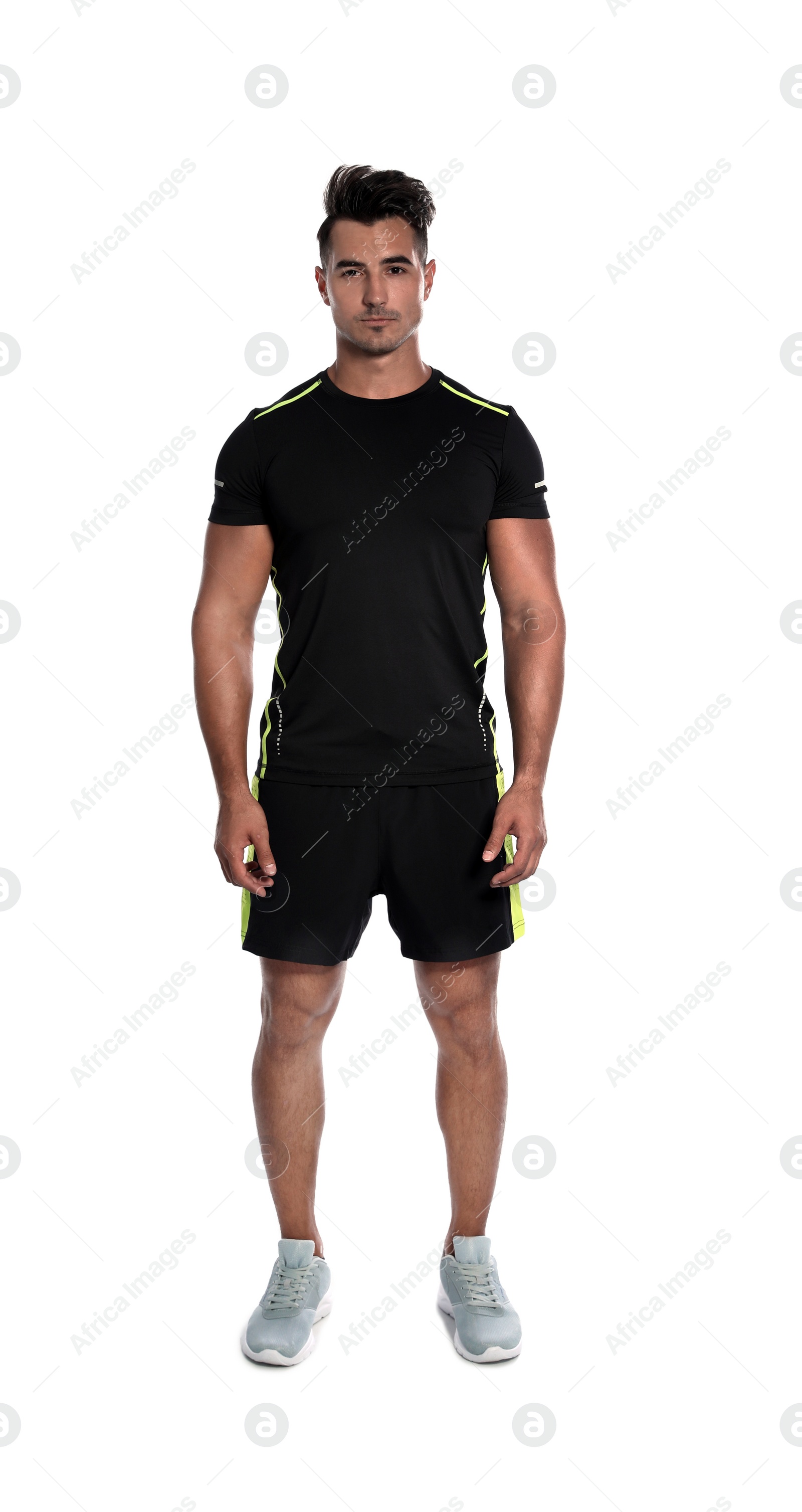 Photo of Sporty young runner standing on white background