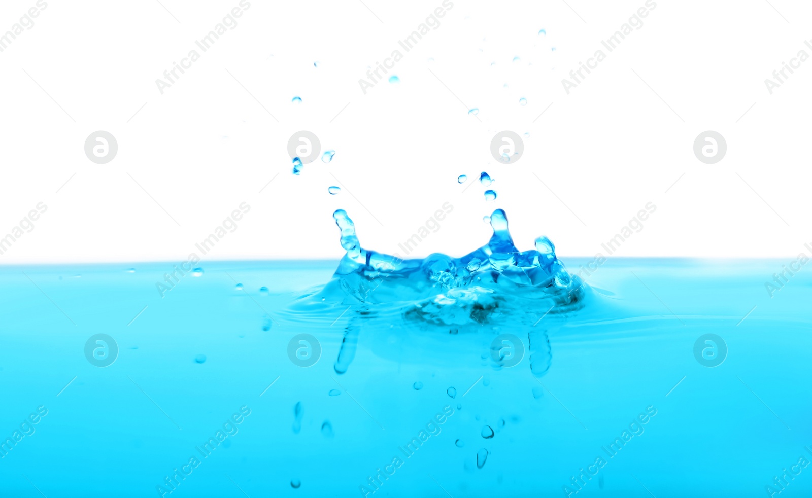 Photo of Splash of blue water with drops on white background