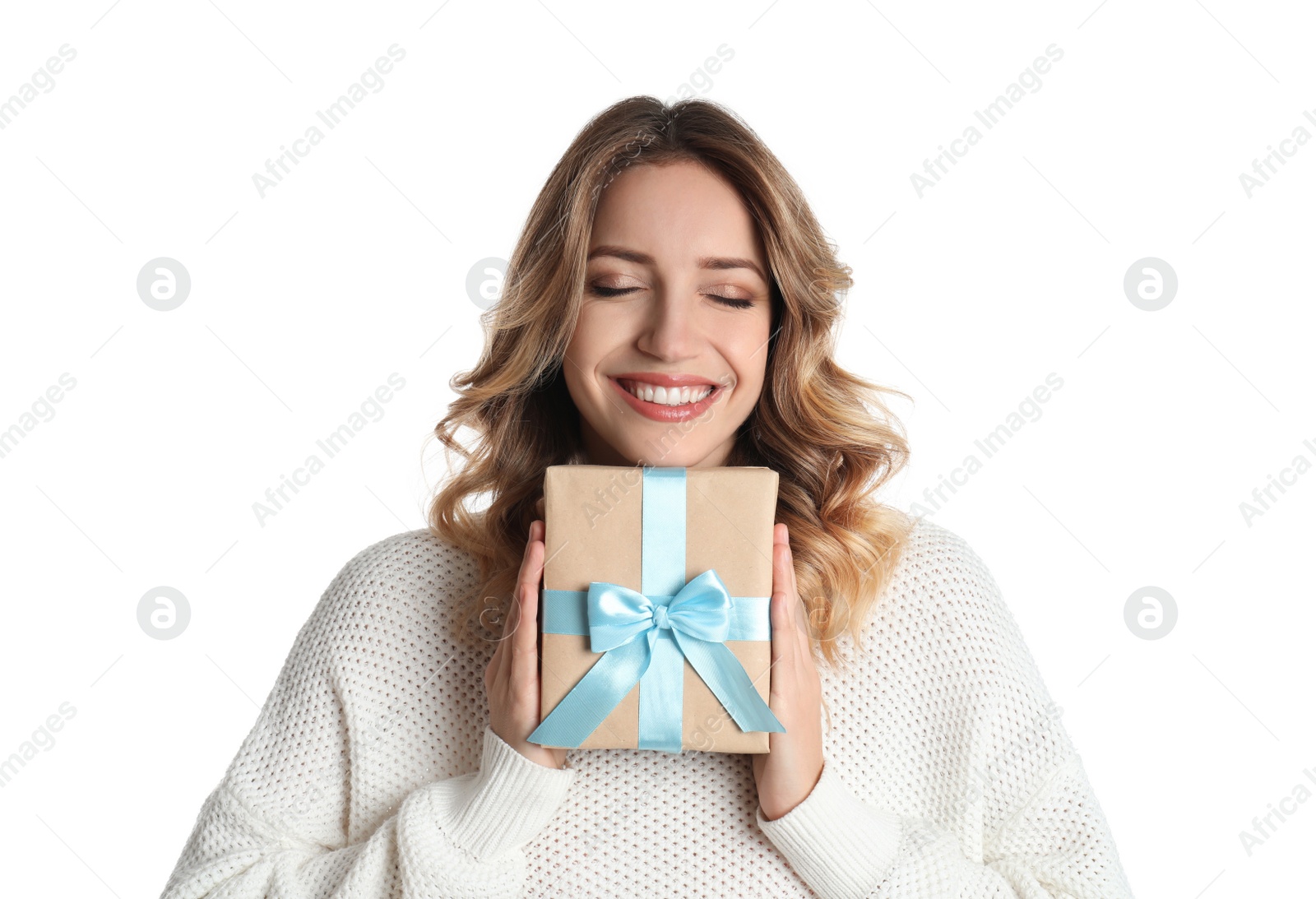 Photo of Beautiful young woman with Christmas present on white background