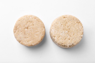 Solid shampoo bars on white background, flat lay