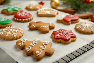 Photo of Tasty homemade Christmas cookies on parchment paper
