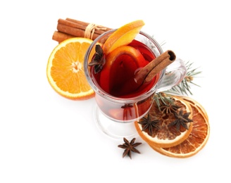 Photo of Composition with glass cup of mulled wine, cinnamon, orange and fir branch on white background