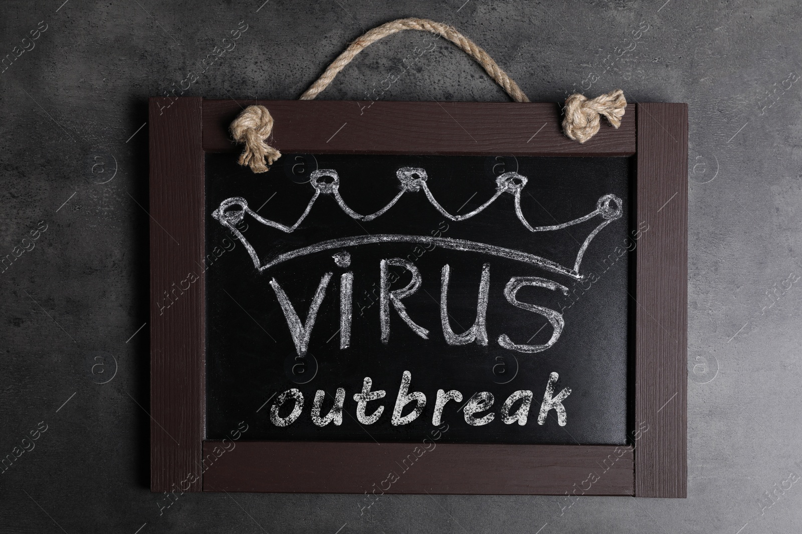 Photo of Blackboard with words Virus Outbreak on grey table, top view