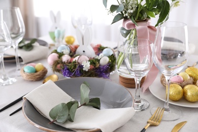 Photo of Beautiful Easter table setting with festive decor indoors