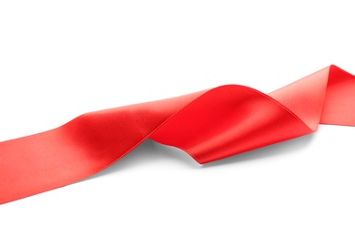 Photo of Simple red ribbon on white background. Festive decoration