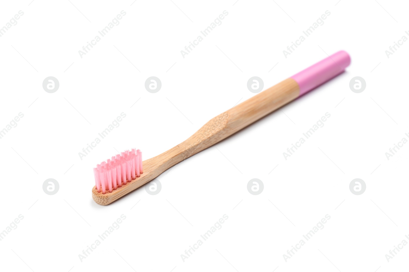 Photo of Bamboo toothbrush with pink bristle isolated on white