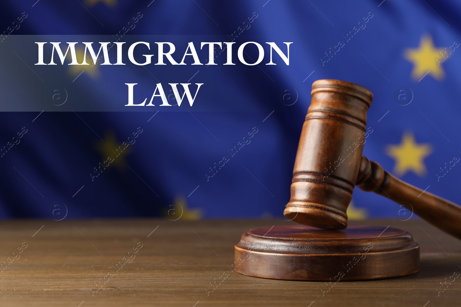 Image of Immigration law. Judge's gavel on wooden table against European Union flag