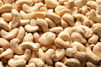 Photo of Organic cashew nuts as background. Tasty snack