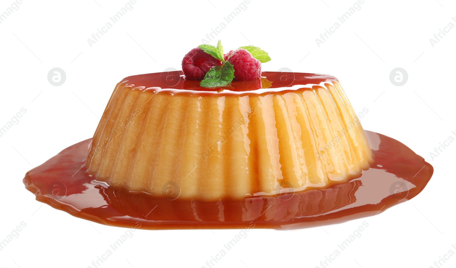 Photo of Delicious pudding with caramel, raspberries and mint isolated on white