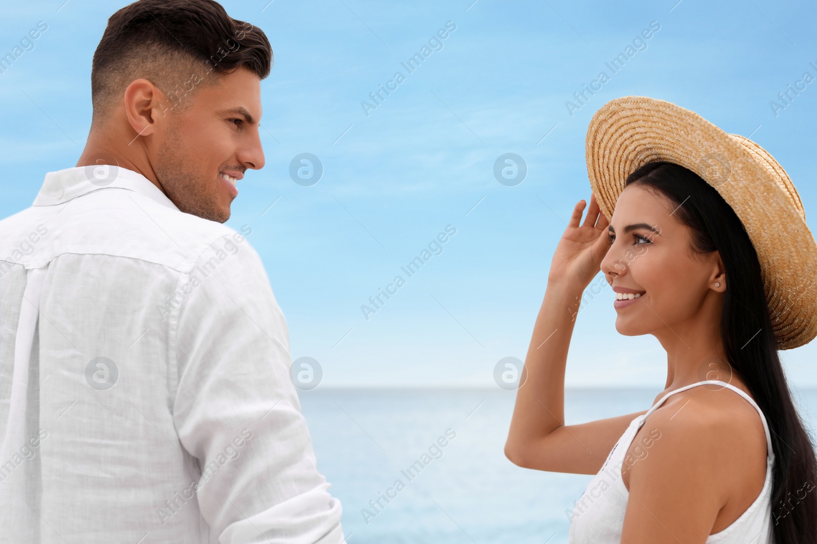 Photo of Lovely couple spending time together on beach