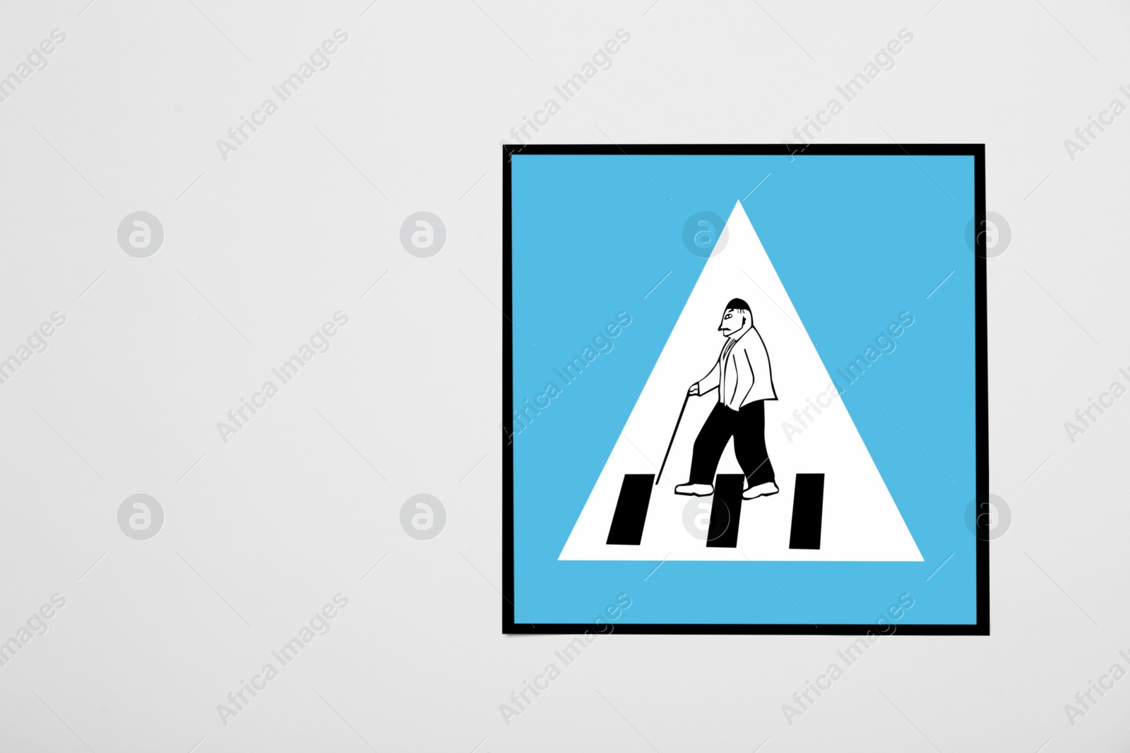 Photo of Pension concept. Paper road sign for pedestrian crossing with elderly man on white background, top view and space for text