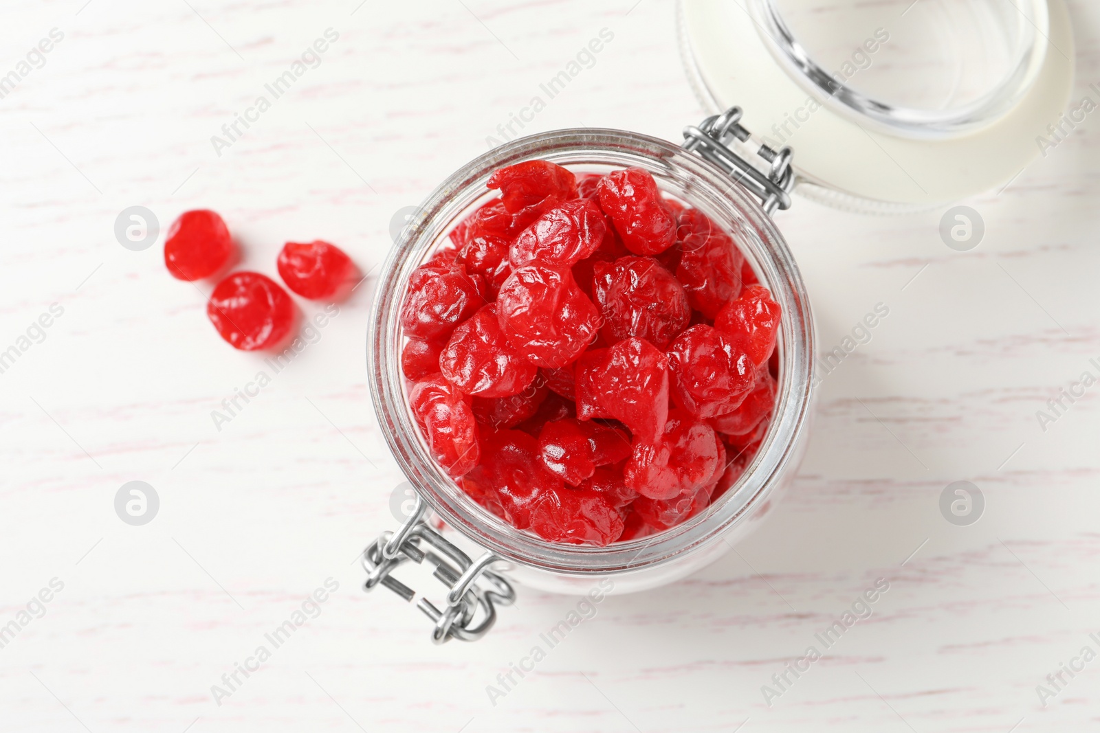 Photo of Jar with tasty cherries on wooden background, top view. Dried fruits as healthy food