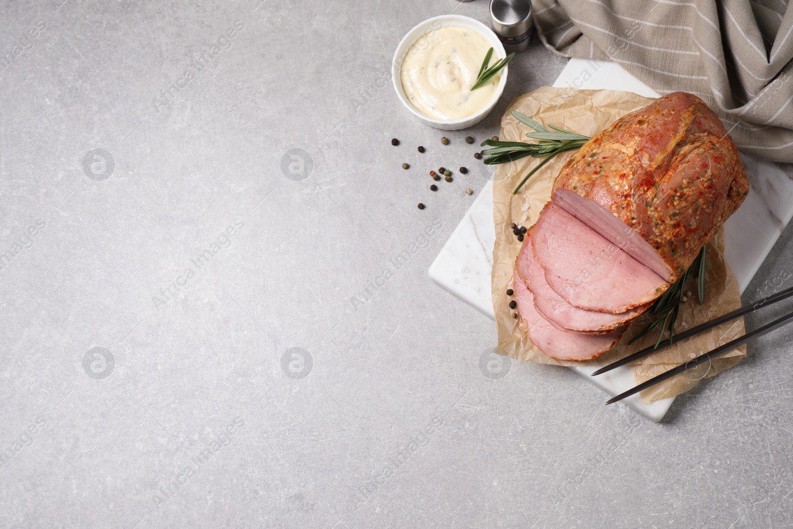 Photo of Delicious ham served on grey table, flat lay. Space for text