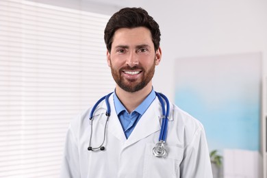 Photo of Portrait of medical consultant with stethoscope in clinic