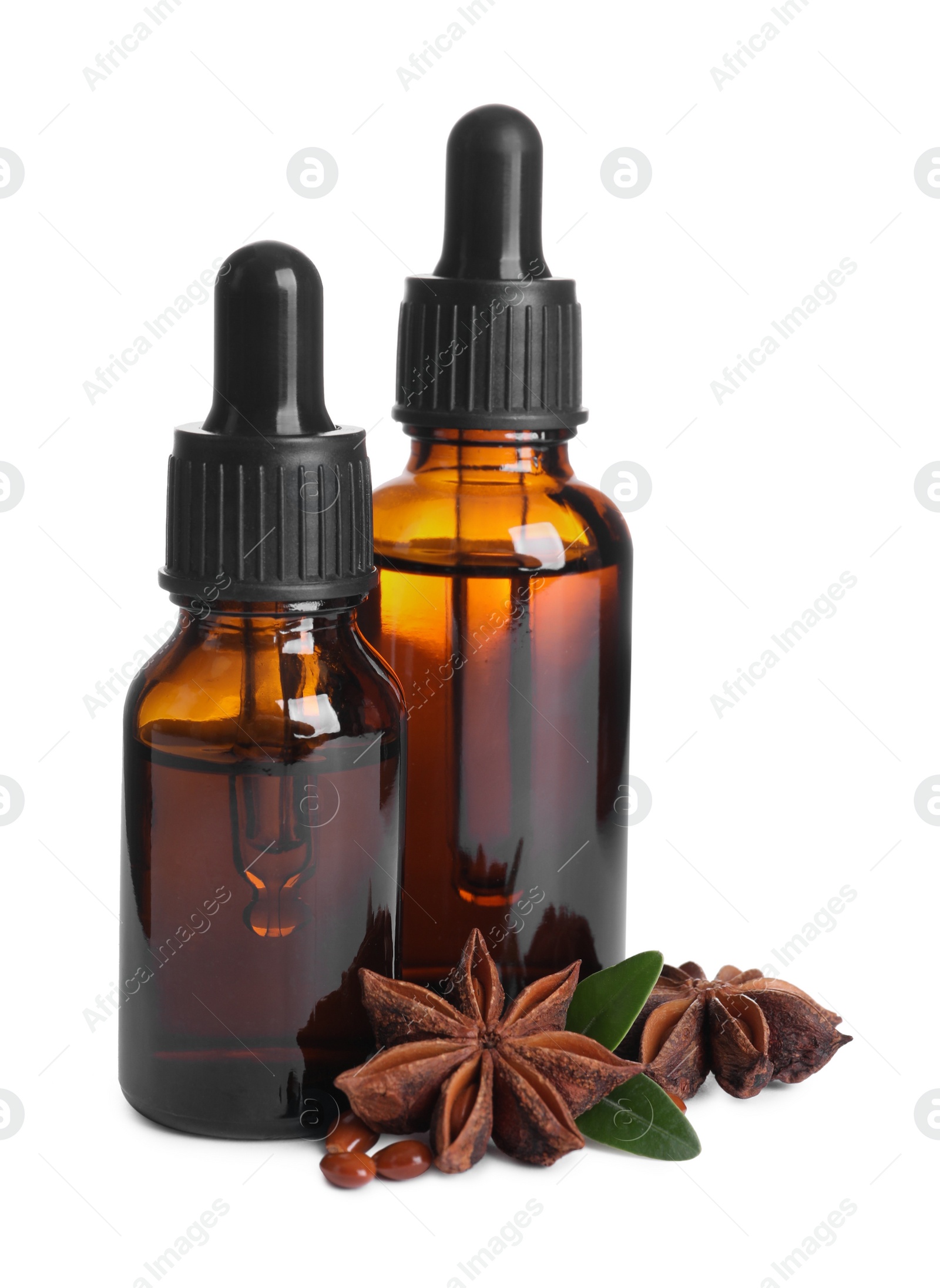 Photo of Anise essential oil and spice on white background