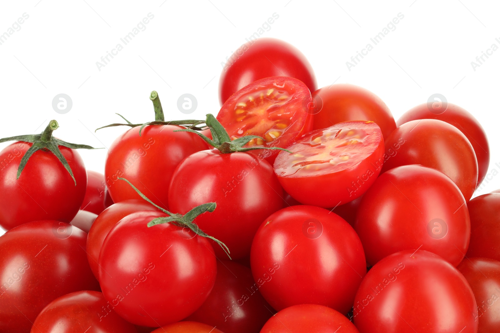 Photo of Whole and cut cherry tomatoes isolated on white, closeup