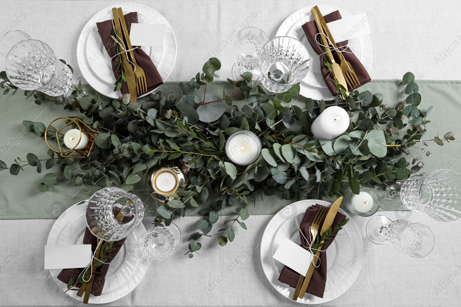 Photo of Luxury table setting with beautiful decor and blank cards. Festive dinner