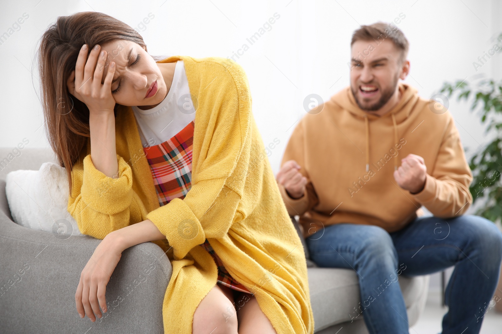 Photo of Couple having quarrel at home. Relationship problems