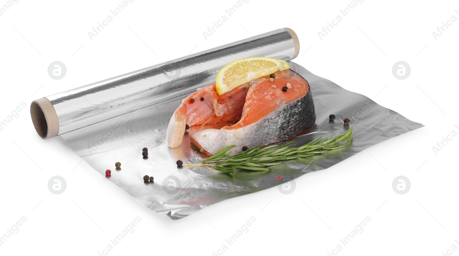 Photo of Aluminum foil with raw salmon, lemon slices, rosemary and spices isolated on white