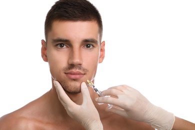 Photo of Man getting facial injection on white background. Cosmetic surgery