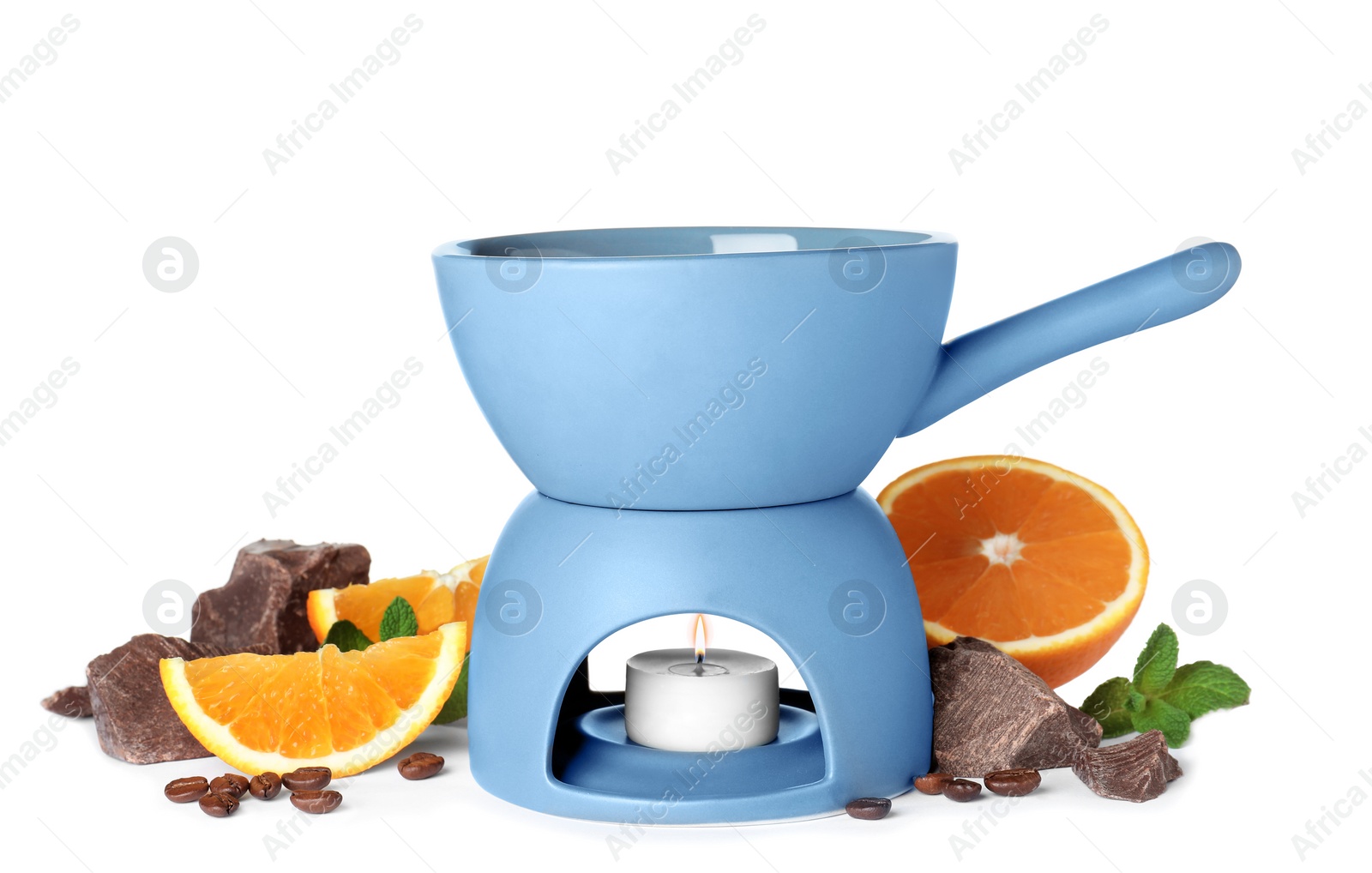 Photo of Fondue pot with chocolate and fruits on white background