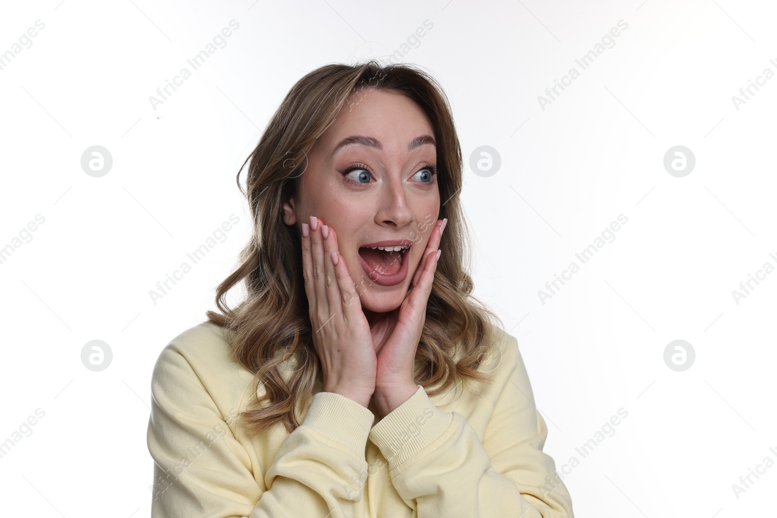 Photo of Portrait of happy surprised woman on white background