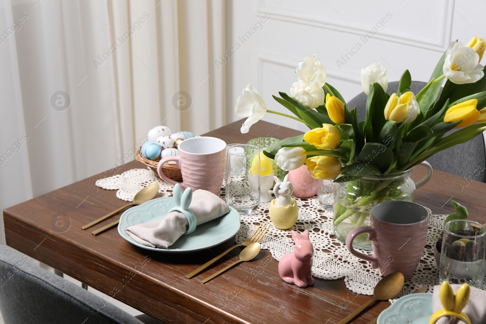 Photo of Festive table setting with beautiful flowers. Easter celebration