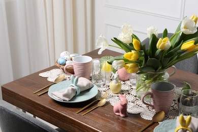 Photo of Festive table setting with beautiful flowers. Easter celebration