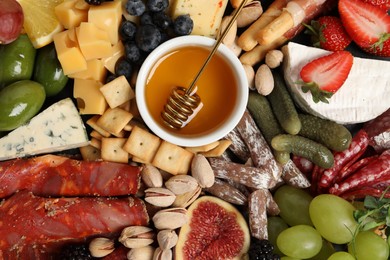 Set of different delicious appetizers as background, top view