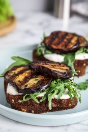 Photo of Delicious fresh eggplant sandwiches on plate, closeup
