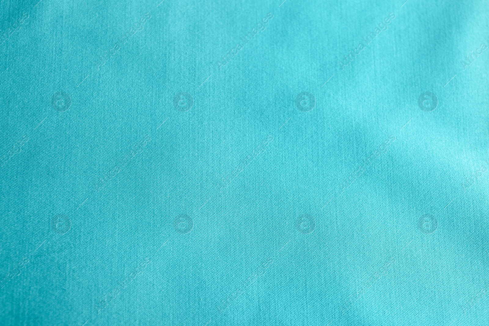 Photo of Texture of delicate blue fabric as background, closeup