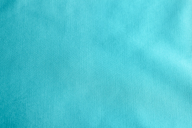 Photo of Texture of delicate blue fabric as background, closeup