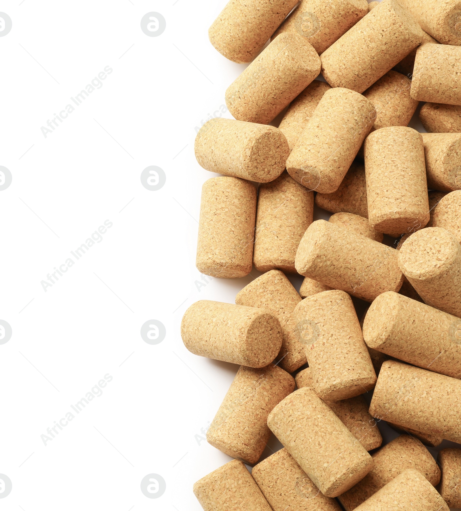 Photo of Wine bottle corks on white background, top view