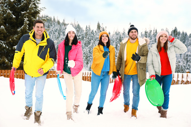 Group of friends outdoors on snowy day. Winter vacation