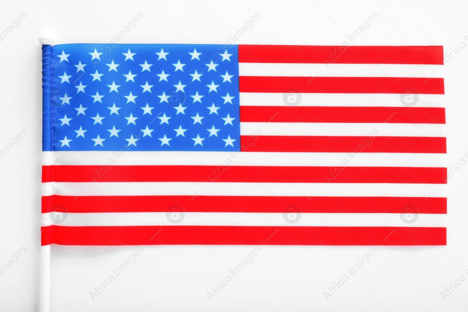 Photo of American flag on white background, top view