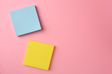 Photo of Blank paper notes on pink background, flat lay. Space for text