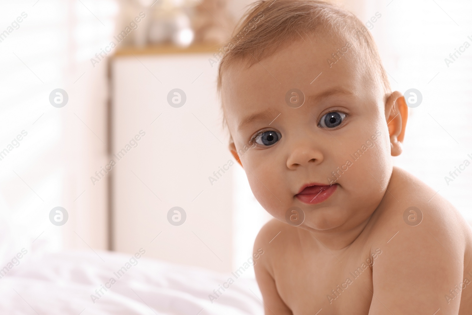 Photo of Portrait of cute little baby at home. Space for text