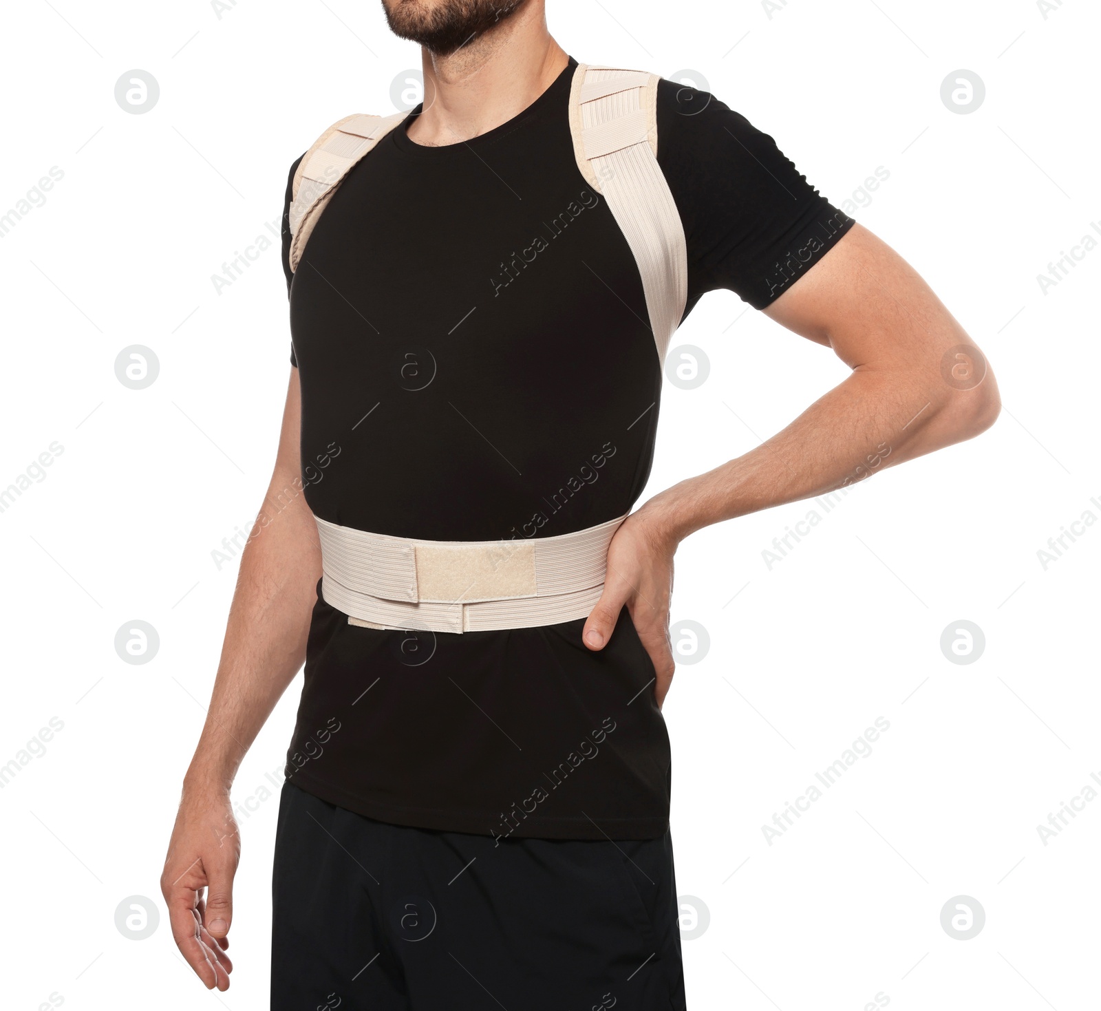 Photo of Closeup view of man with orthopedic corset on white background