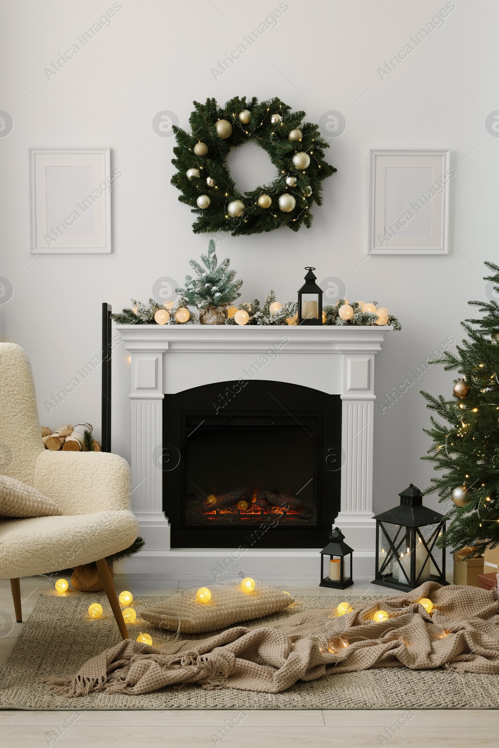 Photo of Cosy room with fireplace decorated for Christmas