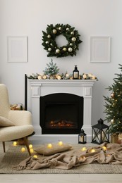 Photo of Cosy room with fireplace decorated for Christmas