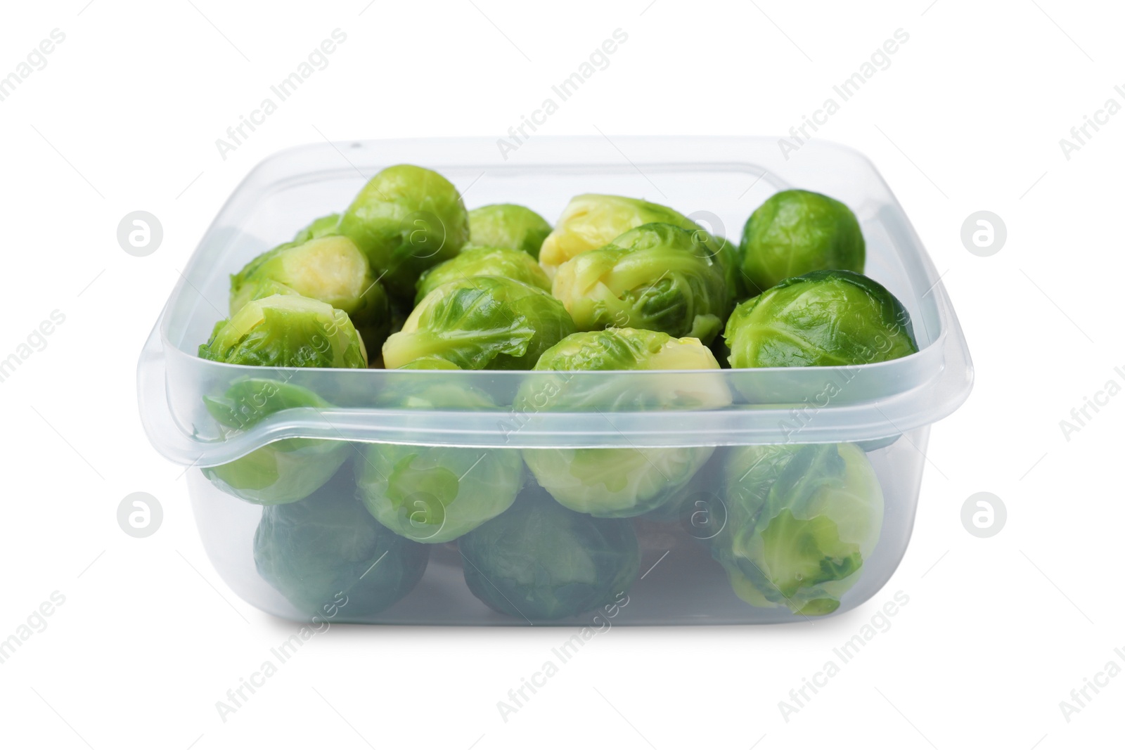 Photo of Brussels sprouts in plastic container isolated on white