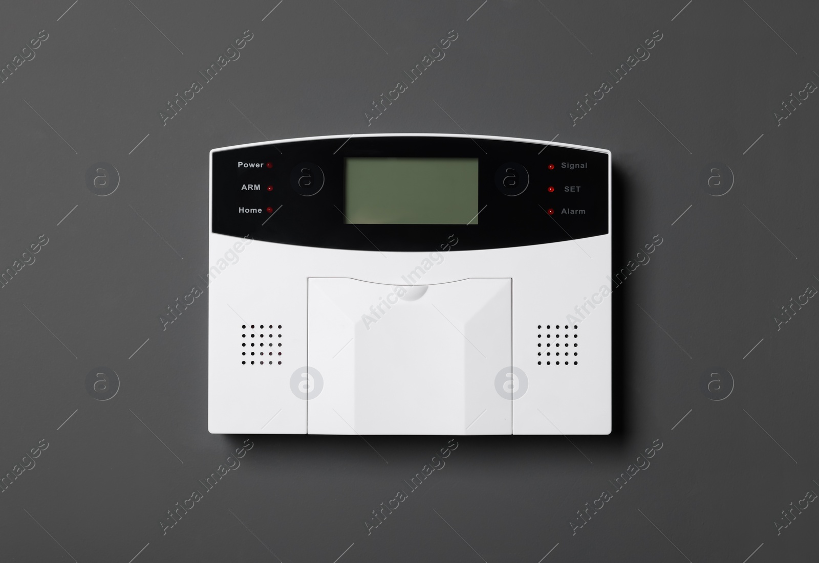Photo of Home security alarm system on gray wall