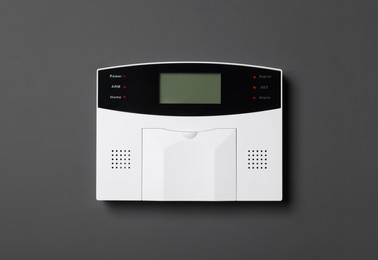 Photo of Home security alarm system on gray wall