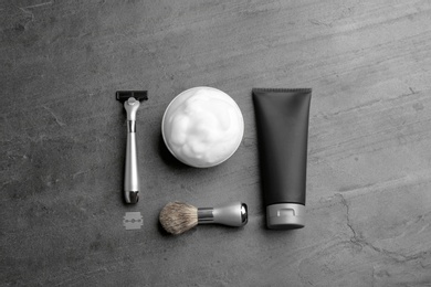 Photo of Flat lay composition with men's cosmetic products on grey background. Space for design