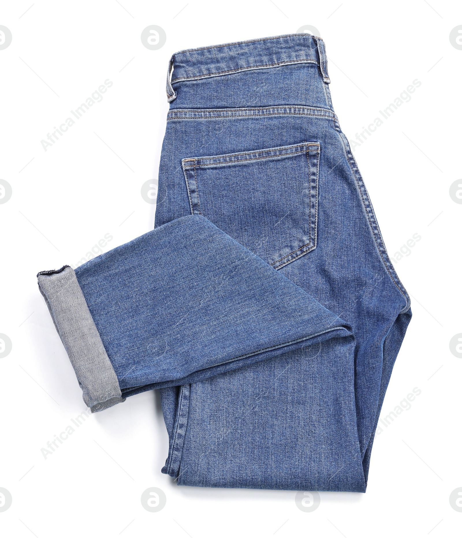 Photo of Stylish jeans on white background, top view