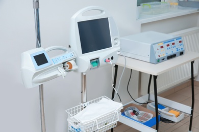 Photo of Syringe dispenser system in modern clinic. Surgery equipment