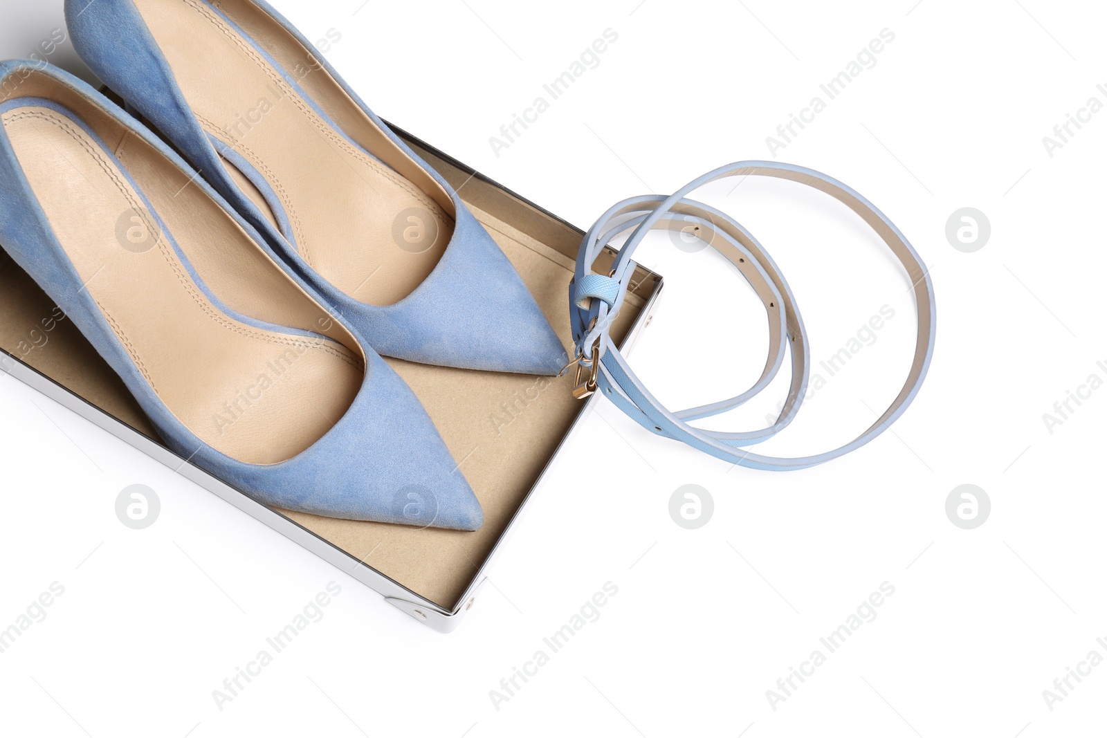 Photo of Pair of lady's shoes and belt on light background