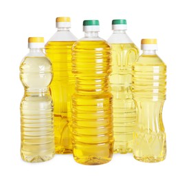 Photo of Bottles of cooking oil on white background